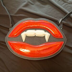 Vampire lips purse